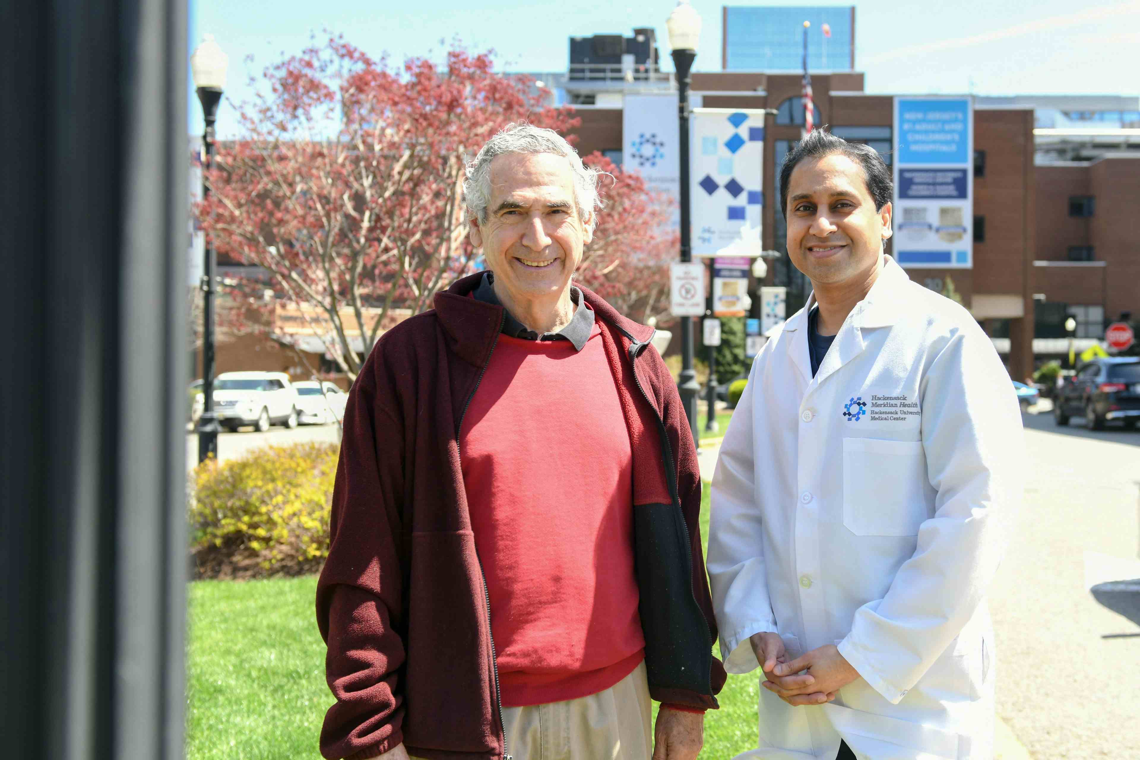 Peter Kahan and his oncologist and former student, Dr. Ravi Munver smiling and standing outside Hackensack University Medical Center |   Photo courtesy Hackensack University Medical Center